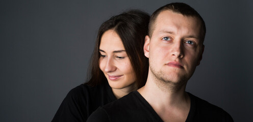 
close-up portrait of a pair of beautiful young guys and girls with a range of emotions and views on a dark background