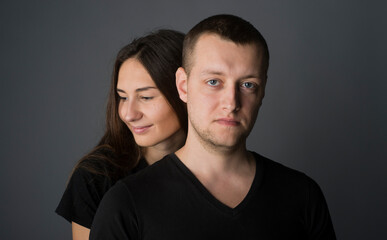 
close-up portrait of a pair of beautiful young guys and girls with a range of emotions and views on a dark background