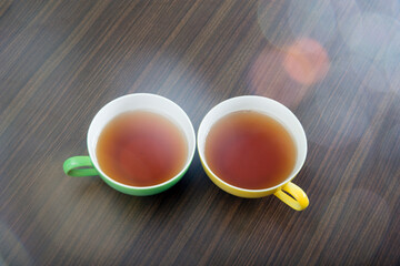yellow and green tea cups 