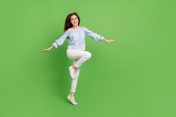 Fototapeta na wymiar Full size photo of cute carefree energetic girl spend summer holidays go traveling isolated on green color background