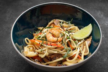 Spaghetti with seafood on a dark background