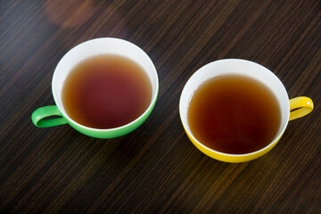 yellow and green tea cups 