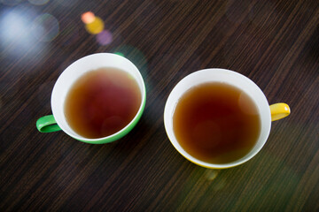 yellow and green tea cups 