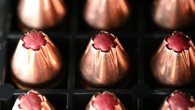 shiny new 9mm hollow point bullets for war, well lit slow macro slide