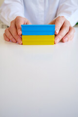 Yellow-blue plasticine in hands on a light background
Independence of Ukraine. Flag. Ukraine love concept