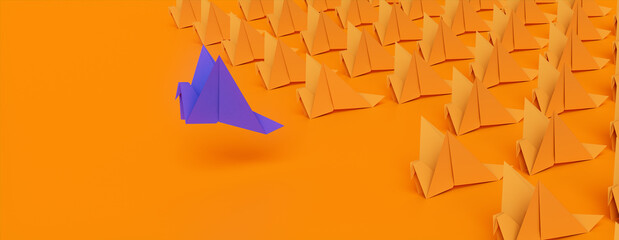 Origami Birds against a Orange background. Manager concept with Copy Space.