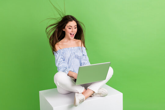Photo of adorable excited amazed girl see big sale discount on black friday shopping bargain isolated on green color background