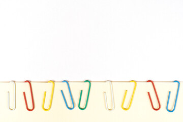 a row of colored paper clips