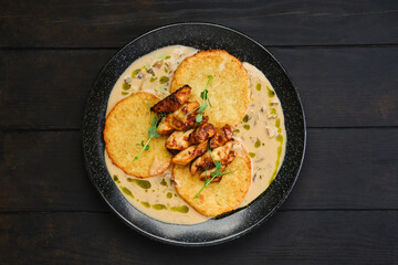 Overhead view of potato fritters with teriyaki chicken