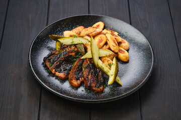 Roasted pork belly slices with gnocchi