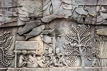 Wall carving of Prasat Bayon Temple, Angkor Wat, Siem Reap, Cambodia - obrazy, fototapety, plakaty