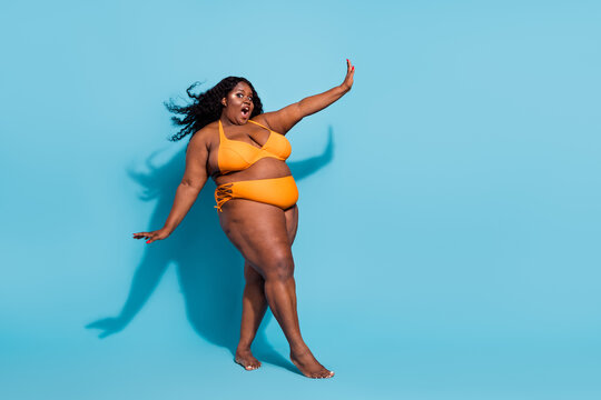 Full length body size view of attractive cheery funny woman dancing posing having fun isolated over bright blue color background