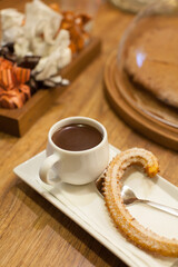 Coffee served with a churro 