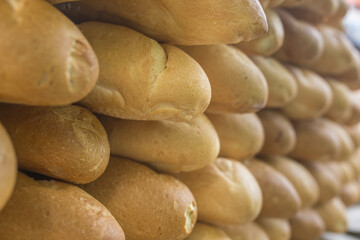 Freshly baked baguettes on a display