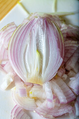 Top view of half a raw purple onion. Chopped onion. Vegetarian healthy food. Shallow depth of field.