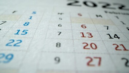 Janyary and February of New Year. 2022. Macro shot of many holidays and business dates in New Year. Cristmas, Valentine's day. February 14. Vacation concept. Dtailed dates calendar 2022