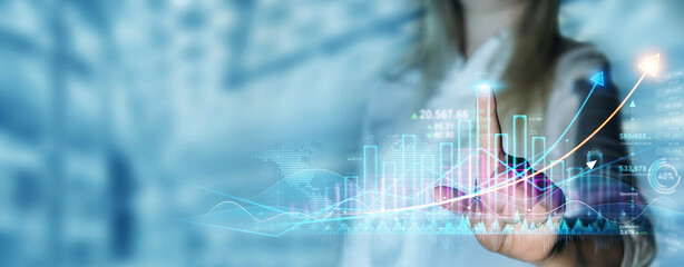 Business person draws growing virtual hologram of statistics, graph and chart. Investment of growth on currency rate.