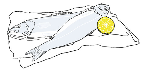 Two fish lie on a piece of paper and next to a lemon