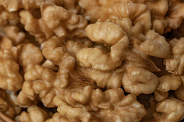 Walnut background. Peeled walnut close-up.