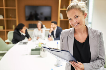Happy business woman with checklist on clipboard