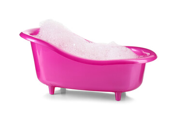 Pink toy bathtub with foam isolated on white