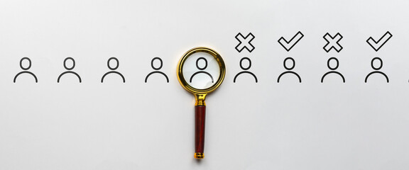 Selection of job candidates. Magnifying glass with abstract personas. Acceptance and rejection.