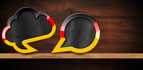 3D illustration of two empty speech bubbles with German flag on a wooden shelf with copy space for a short sentence, with a brown wall on background.