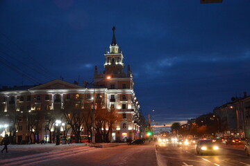 Residential building with a tower in the evening light in the city of Komsomolsk-on-Amur