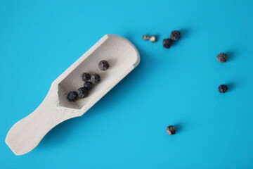 black pepper flakes on spoon