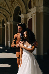 Beautiful African American girl in wight dress with her husband