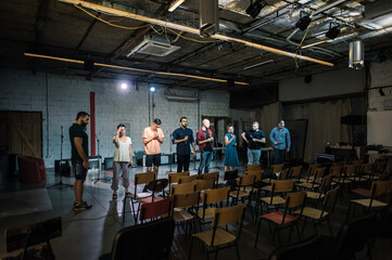 Fototapeta na wymiar Rehearsal at theatre. Actors preparing for role. Behind the scene