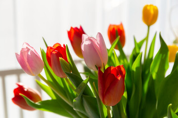 Bouquet of spring tulips on the dining room table