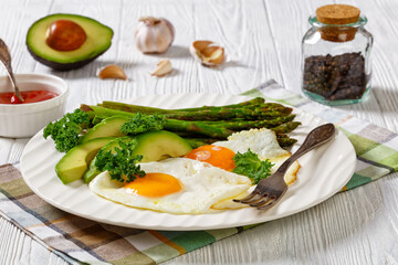 roast asparagus, ripe avocado and fried eggs