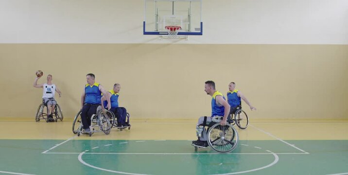 Persons with disabilities play basketball in the modern hall