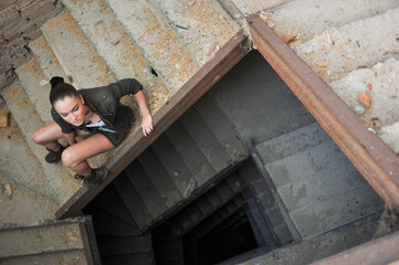 Beautiful woman, military style. War in the city