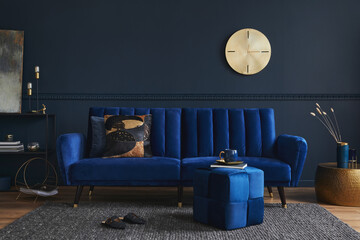 Stylish modern living room interior design with glamour blue sofa, metal shelf, coffee table, pouf...