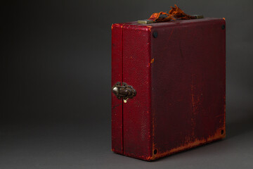 Vintage red case with shabby handle.