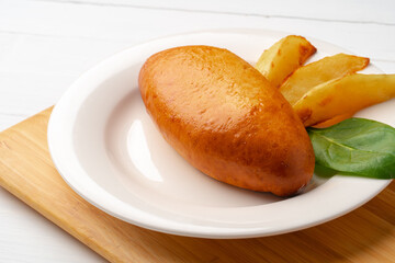 Traditional Russian pie or patty on white plate