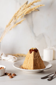 Cheese paskha with nuts and chocolate. Traditional Russian or Ukrainian Easter dish. 