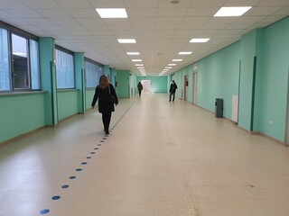 corridor of modern hospital with people