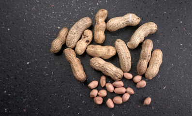 Composition of peanuts serving to make oil, peanut butter. Great for healthy and dietary nutrition. Concept of: condiments, dried fruit, food.