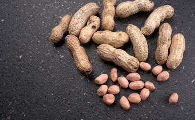 Composition of peanuts serving to make oil, peanut butter. Great for healthy and dietary nutrition. Concept of: condiments, dried fruit, food.