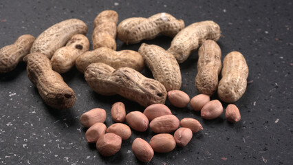 Composition of peanuts serving to make oil, peanut butter. Great for healthy and dietary nutrition. Concept of: condiments, dried fruit, food.