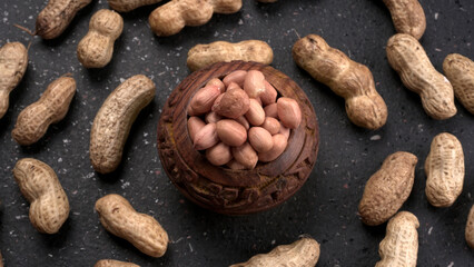 Composition of peanuts serving to make oil, peanut butter. Great for healthy and dietary nutrition. Concept of: condiments, dried fruit, food.