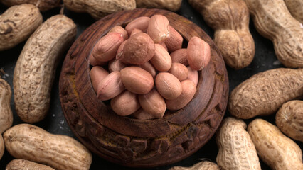 Composition of peanuts serving to make oil, peanut butter. Great for healthy and dietary nutrition. Concept of: condiments, dried fruit, food.