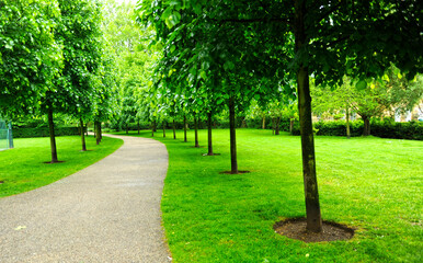Path in a small park near Fulham Road. Cityscape of Fulham, London, UK