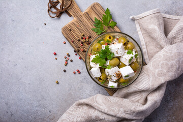 Bowl of delicious olives with Feta cheese in oil