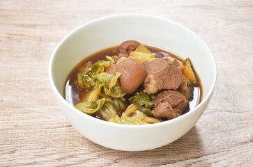 boiled salty pork leg with pickled cabbage in fish sauce soup on bowl