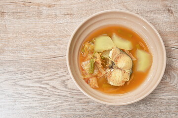 spicy boiled snake head fish and mixed vegetable in spicy soup on bowl