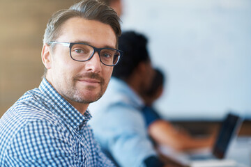 He always brings his A-game to work. Cropped portrait of a mature businessman in an office.